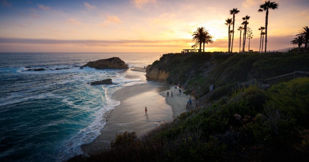 a beach in southern california at sunset