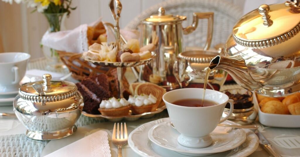 pouring tea at a formal high tea gathering