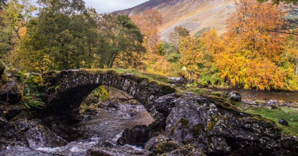 a bridge over a river in aberfeldy, scotland