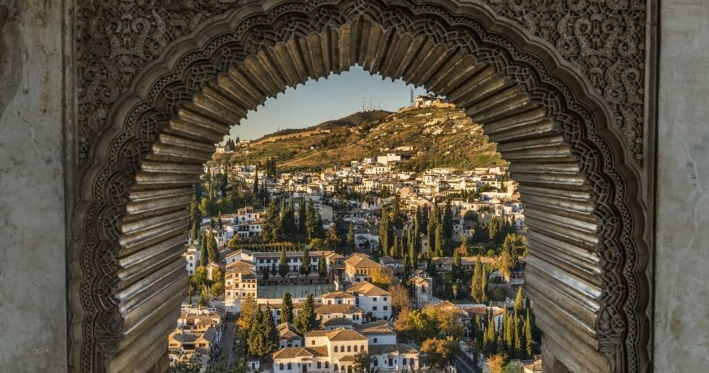 a window overlooking the city of granada, spain