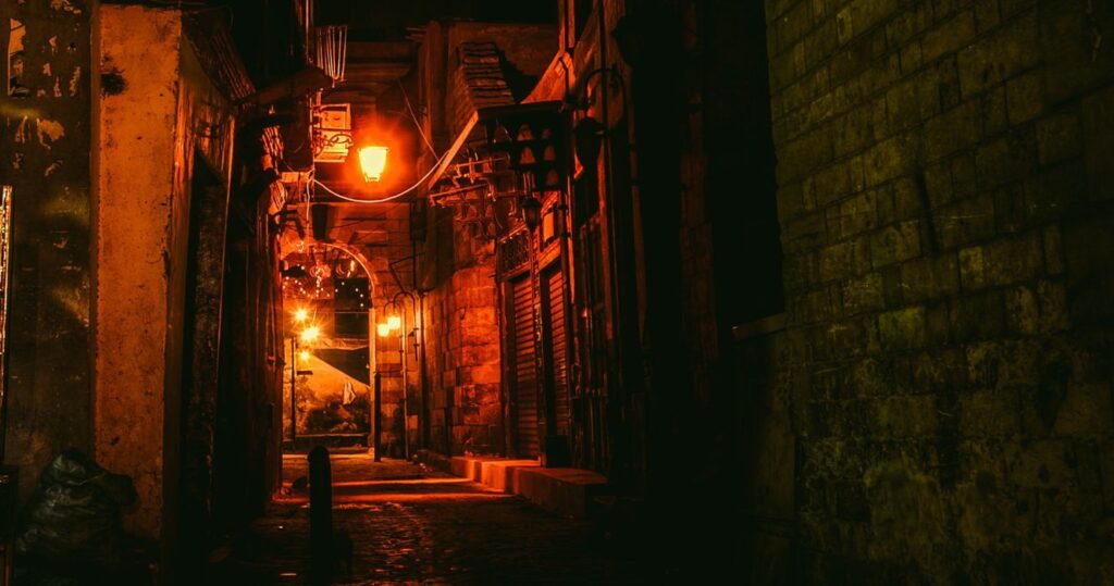 an alley with a red light in cairo, egypt