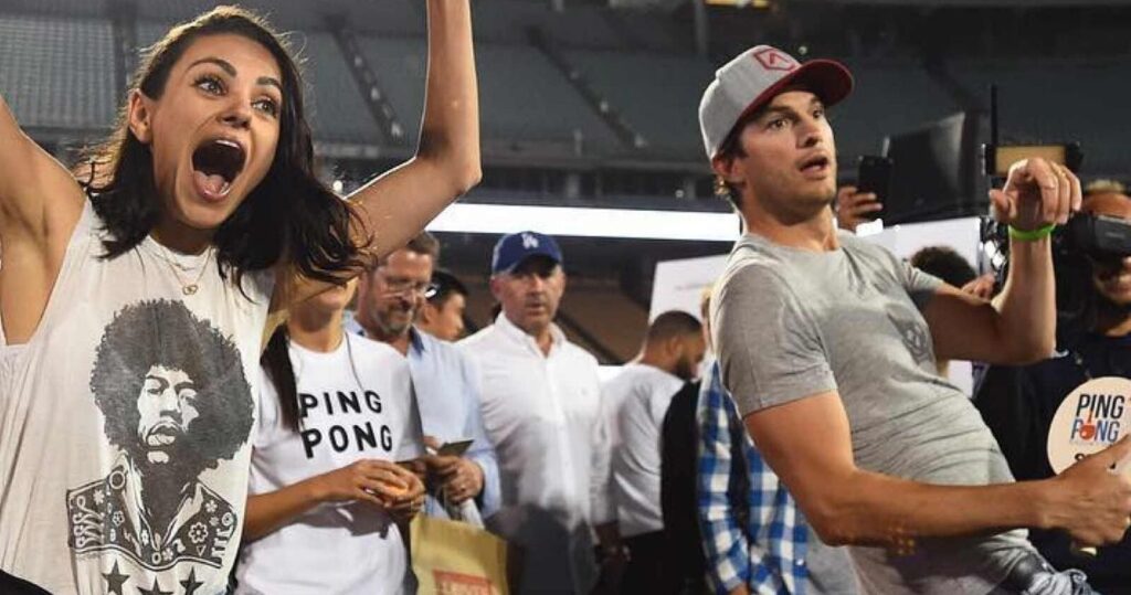 Mila Kunis and Ashton Kutcher cheering at a table tennis tournament