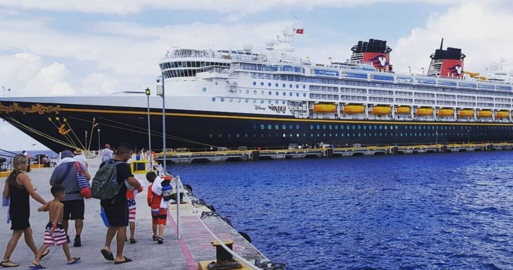 Passengers preparing to board a Disney cruise ship