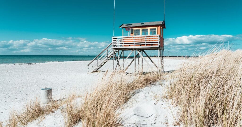 a lighthouse station on a beach in skane